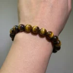 close-up of tiger’s eye beads symbolizing focus and strength