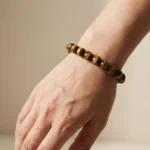 close-up of tiger’s eye bracelet showing natural reflection