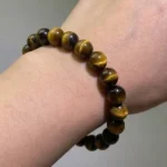 tiger’s eye bracelet lifestyle shot showing natural golden bands