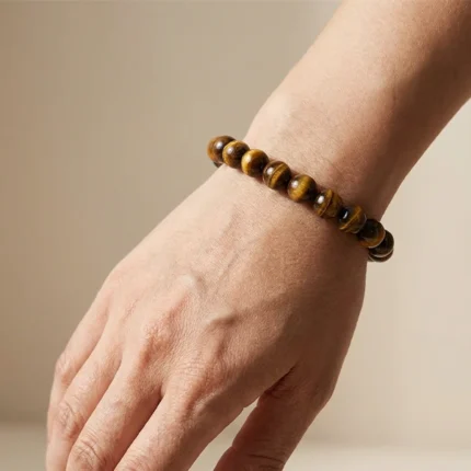 close-up of tiger’s eye bracelet showing natural reflection
