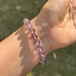 model wearing amethyst bracelet for peace and intuition