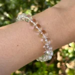 model wearing clear quartz bracelet for clarity and intention