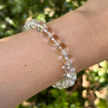 model wearing clear quartz bracelet for clarity and intention