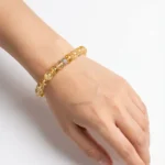 model wearing citrine bracelet for confidence and abundance