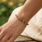 aurora tourmaline bracelet lifestyle shot with soft colorful tones
