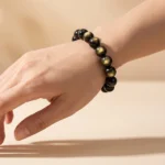 golden obsidian bracelet lifestyle photo highlighting golden sheen