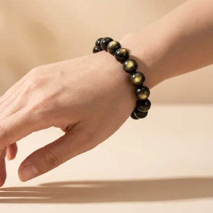 golden obsidian bracelet lifestyle photo highlighting golden sheen
