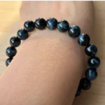 blue Tigers Eye bracelet on model under natural light