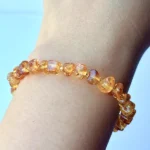 close shot of model wearing Amber Chip Bracelet