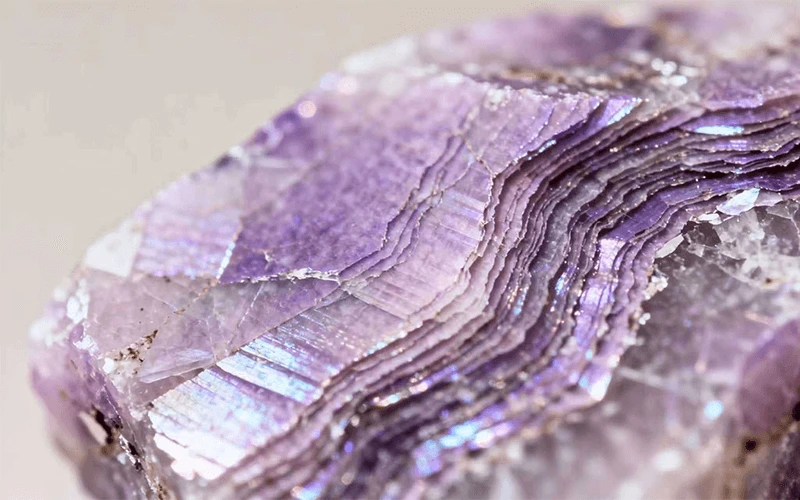 close-up detail of natural lepidolite with mica texture and lilac tones