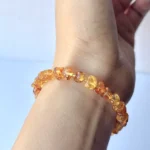 model wearing Amber Chip Bracelet under natural light