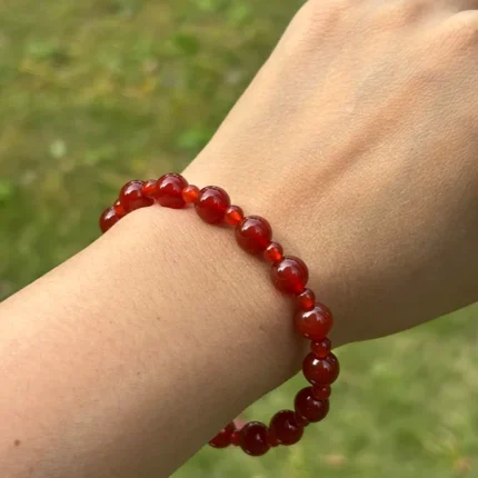 model wearing Carnelian round beads Bracelet front view
