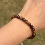 model wearing Copper Rutilated Quartz Bracelet close front view