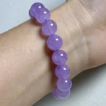 model wearing Gentle Calm Bracelet with star charm back view