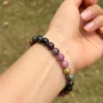 model wearing Rainbow Tourmaline Bracelet under natural light