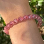 model wearing Strawberry Quartz Bracelet in shadow