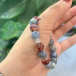 model holding Kyanite & Red Phantom Balance Bracelet