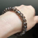 model wearing Smoky Quartz Faceted Bracelet under natural light