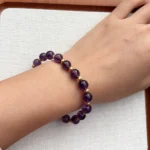 model wearing Still Balance Amethyst Bracelet under natural light
