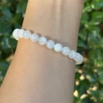 model wearing White Moonstone Bracelet under natural light back view