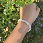 model wearing White Moonstone Bracelet under natural light front view