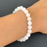 model wearing White Moonstone Bracelet with dark background